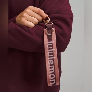Lululemon Never Lost Keychain Wordmark- Garnet/Spiced Chai/Rose Gold